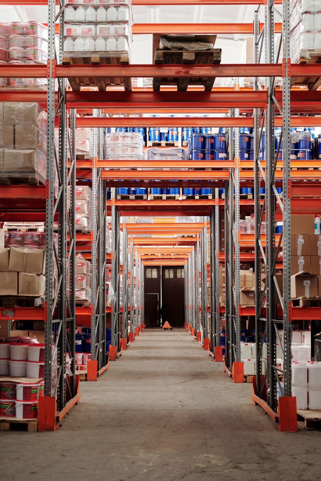 Warehouse shelves holding goods and packaged products